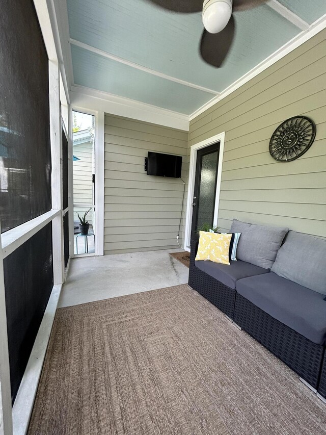 sunroom with ceiling fan and an outdoor hangout area