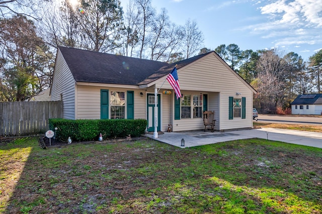 ranch-style home featuring a patio and a front lawn