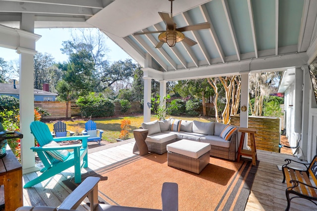 view of patio with an outdoor living space, a wooden deck, and ceiling fan