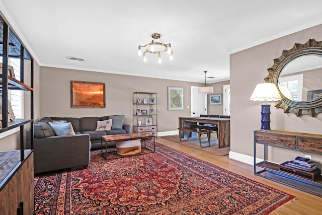 living room featuring ornamental molding and hardwood / wood-style floors