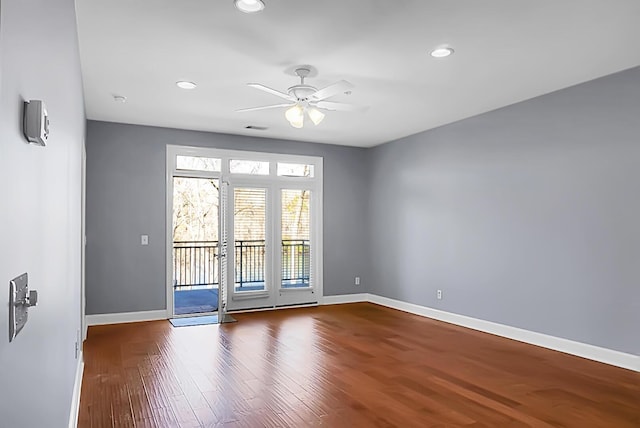 unfurnished room featuring hardwood / wood-style flooring and ceiling fan