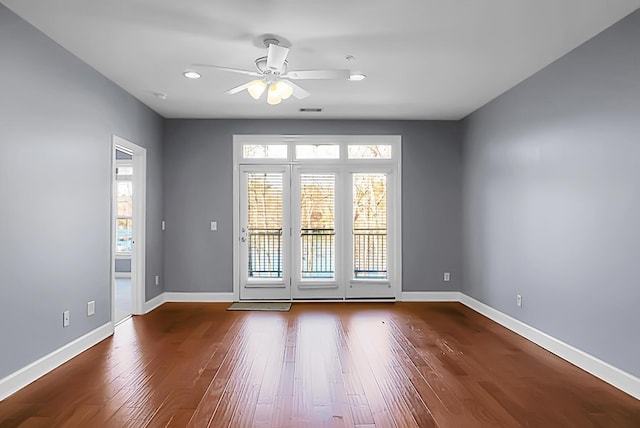 doorway to outside featuring wood-type flooring and ceiling fan