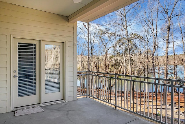 balcony featuring a water view