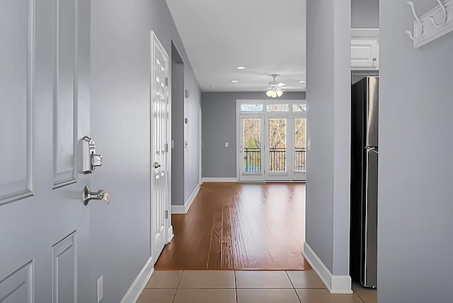 hallway with tile patterned floors