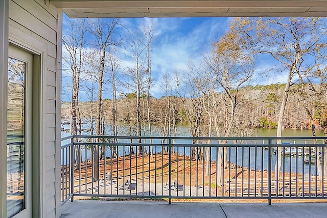 balcony featuring a water view