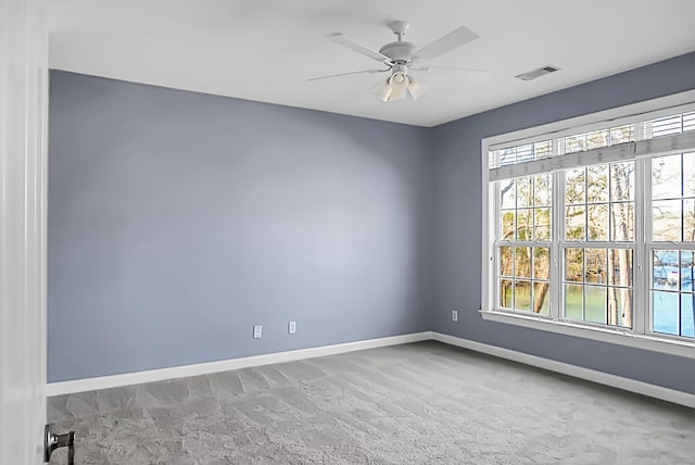 empty room with carpet and ceiling fan