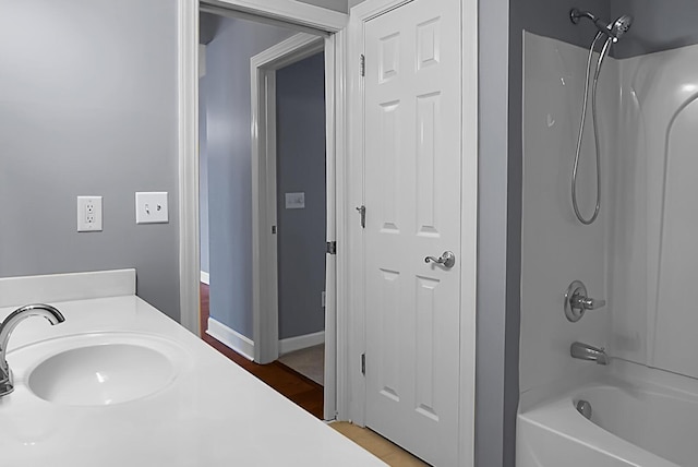 bathroom featuring vanity and tub / shower combination