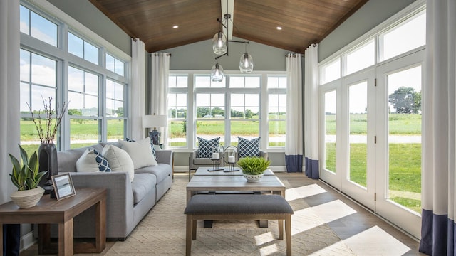 sunroom with wood ceiling and vaulted ceiling