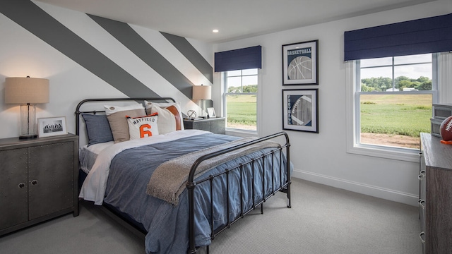 bedroom with baseboards, recessed lighting, and light colored carpet