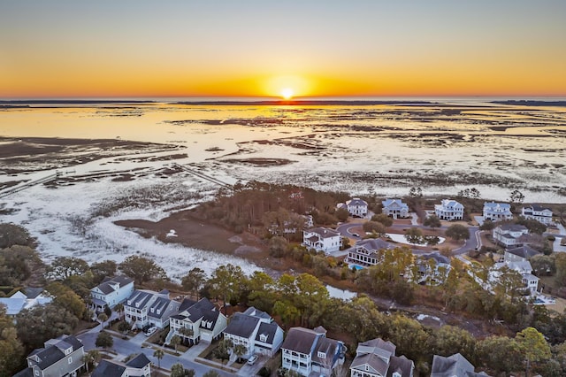 drone / aerial view with a water view and a residential view