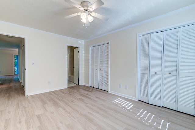 6275 Rolling Fork Rd Unit 401, North Charleston, SC 29406 - unfurnished bedroom with ornamental molding, wood finished floors, two closets, and a ceiling fan