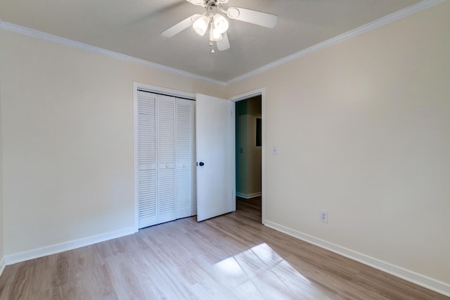 6275 Rolling Fork Rd Unit 401, North Charleston, SC 29406 - unfurnished bedroom featuring wood finished floors, ornamental molding, a closet, and a ceiling fan