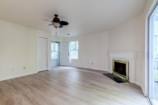 6275 Rolling Fork Rd Unit 401, North Charleston, SC 29406 - unfurnished living room featuring a high end fireplace, ceiling fan, and light wood-style flooring