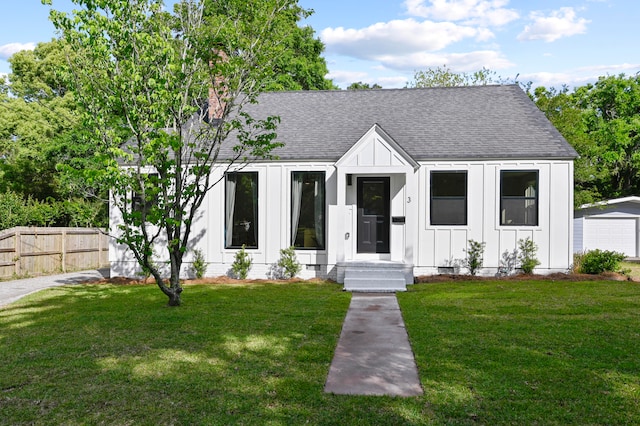 modern farmhouse with a front lawn