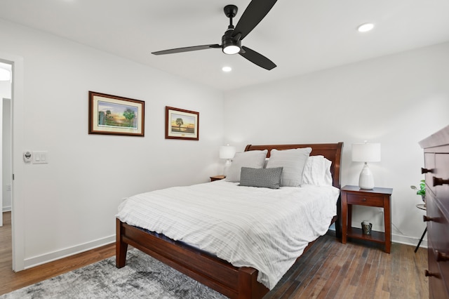 bedroom featuring ceiling fan and dark wood-type flooring