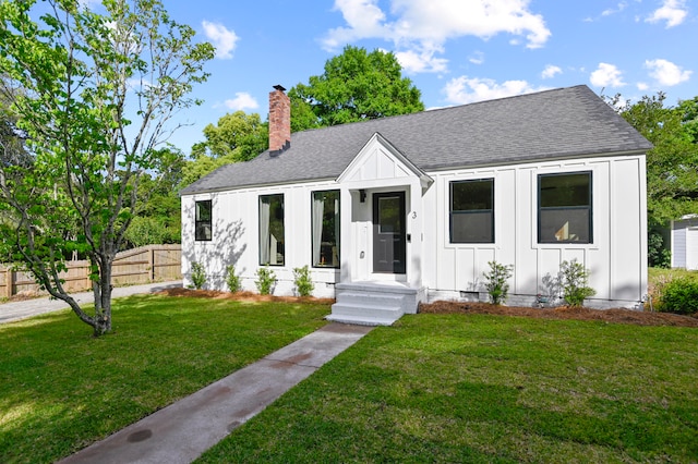 modern farmhouse with a front lawn