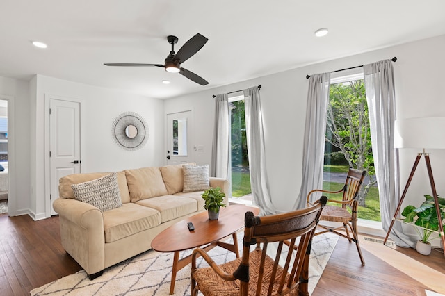 living room with hardwood / wood-style flooring and ceiling fan