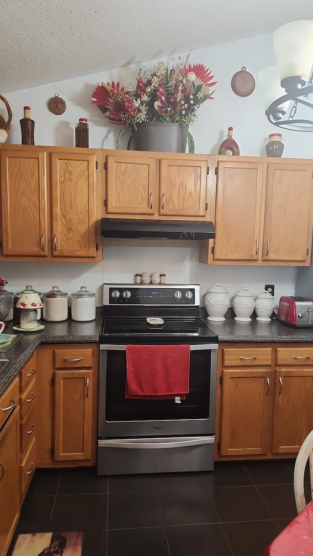 117 Valeworth Dr, Irmo, SC 29063 - kitchen with stainless steel electric stove, under cabinet range hood, dark tile patterned floors, a textured ceiling, and dark countertops