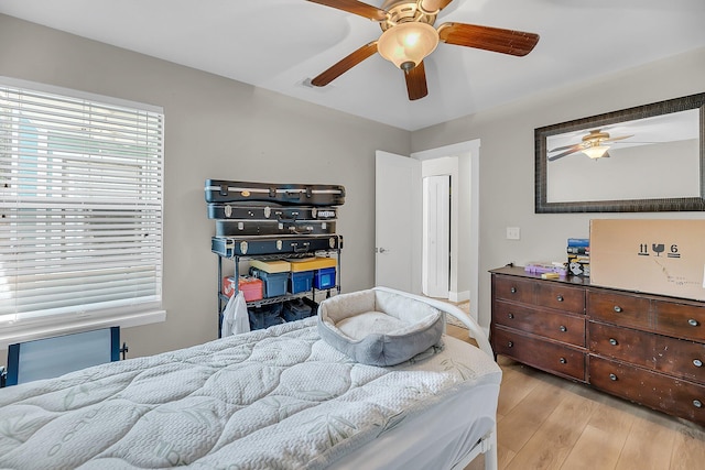 bedroom featuring a ceiling fan and light wood finished floors