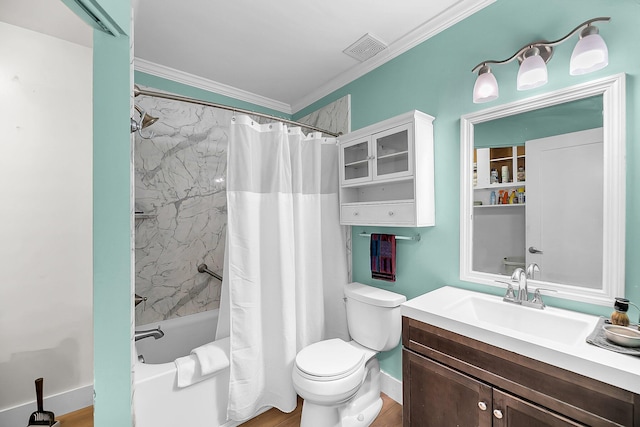 bathroom featuring vanity, toilet, baseboards, shower / tub combo, and visible vents