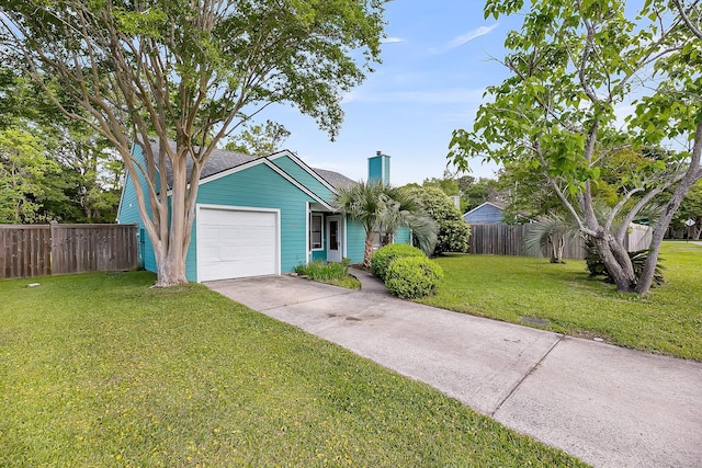 ranch-style house featuring fence, a front yard, a chimney, concrete driveway, and an attached garage