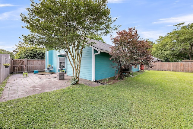 view of yard featuring a fenced backyard and a patio