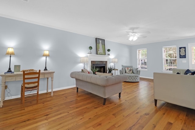 1394 Center Lake Dr, Mount Pleasant, SC 29464 - living area with wood finished floors, ceiling fan, a fireplace, crown molding, and baseboards
