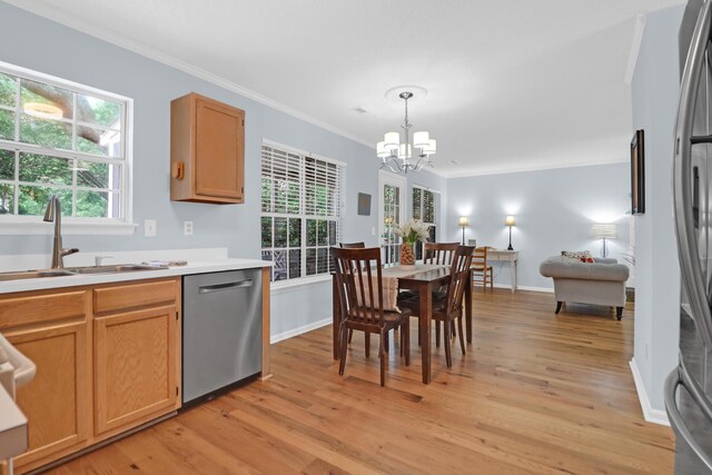 1394 Center Lake Dr, Mount Pleasant, SC 29464 - kitchen with appliances with stainless steel finishes, a sink, a chandelier, light wood-type flooring, and ornamental molding