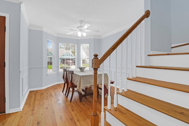 1394 Center Lake Dr, Mount Pleasant, SC 29464 - dining room featuring ornamental molding, ceiling fan, light wood-style floors, stairs, and baseboards
