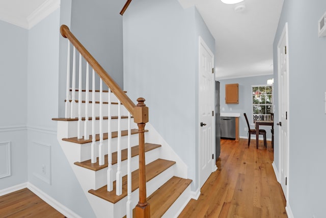 1394 Center Lake Dr, Mount Pleasant, SC 29464 - staircase with wood finished floors, crown molding, and baseboards