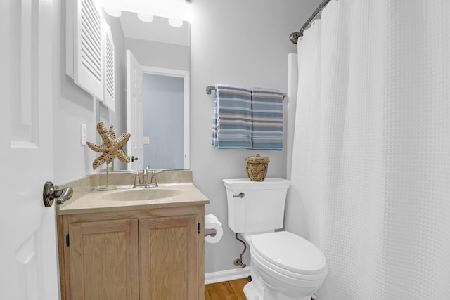 1394 Center Lake Dr, Mount Pleasant, SC 29464 - full bathroom featuring toilet, vanity, wood finished floors, and a shower with shower curtain