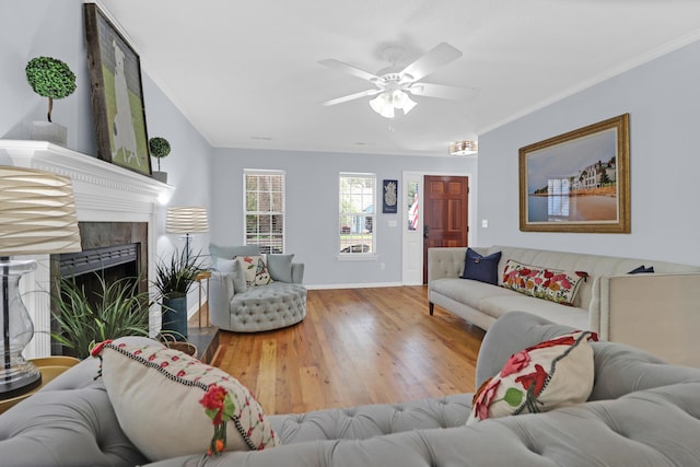 1394 Center Lake Dr, Mount Pleasant, SC 29464 - living area featuring wood finished floors, ceiling fan, baseboards, ornamental molding, and a tiled fireplace