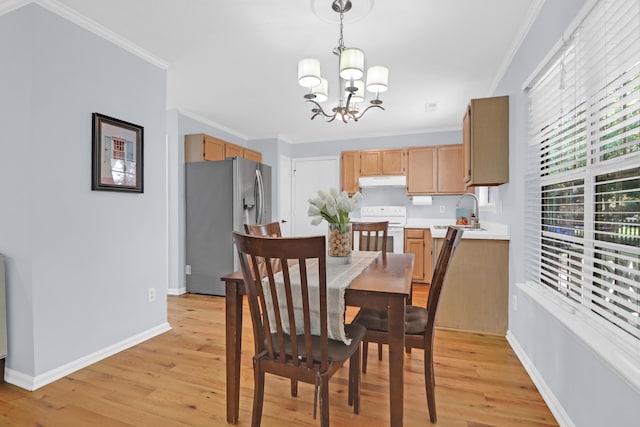 1394 Center Lake Dr, Mount Pleasant, SC 29464 - dining area featuring a chandelier, light wood finished floors, crown molding, and baseboards