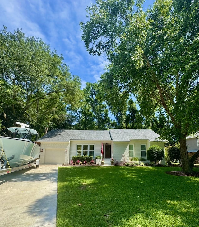 1015 Jacksnipe Ln, Mount Pleasant, SC 29464 - ranch-style house featuring concrete driveway, a garage, and a front yard