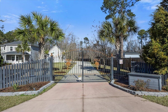 view of gate featuring fence