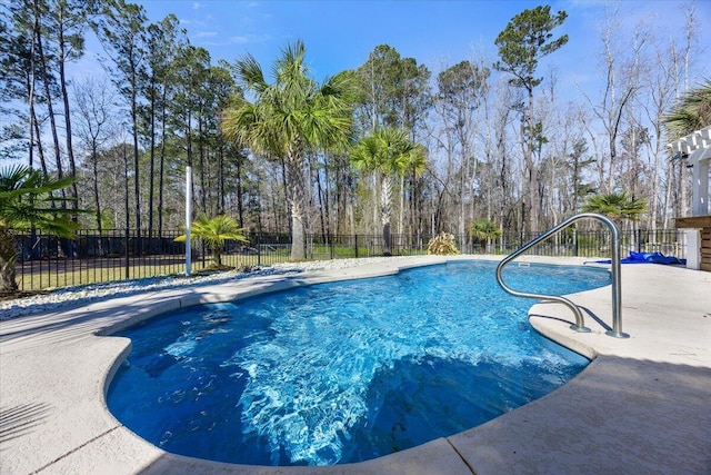 view of swimming pool with fence and a fenced in pool