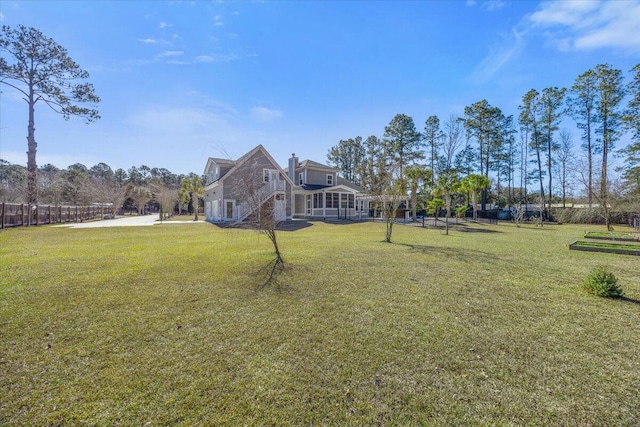 view of yard with a sunroom