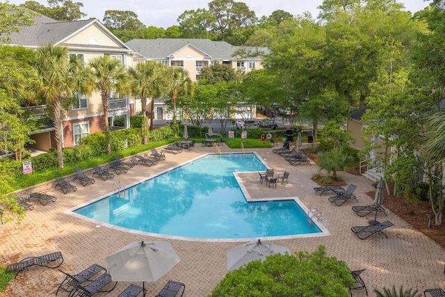 community pool with a patio area