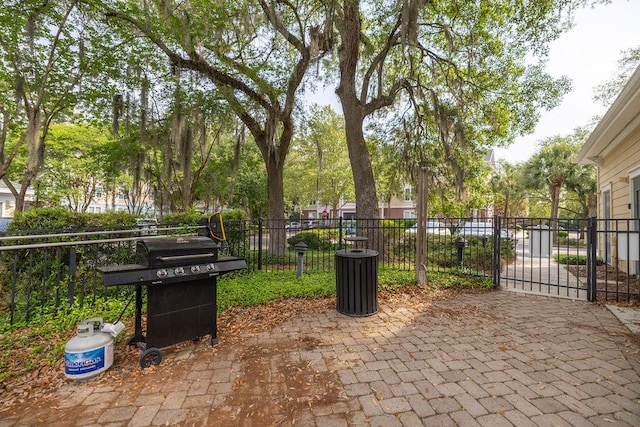 view of patio / terrace featuring fence and a gate