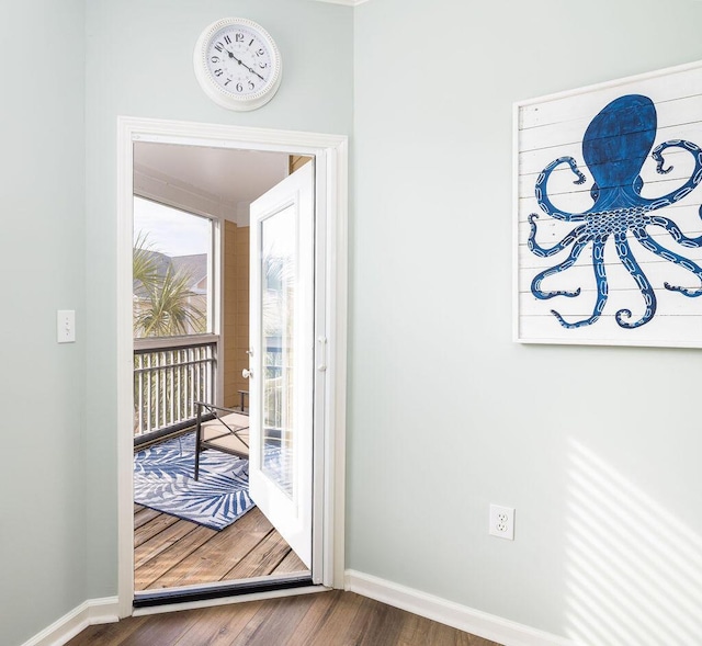 entryway with wood finished floors and baseboards