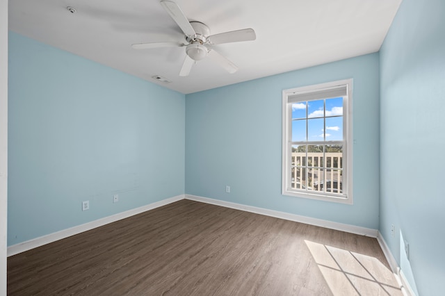 spare room featuring hardwood / wood-style flooring and ceiling fan