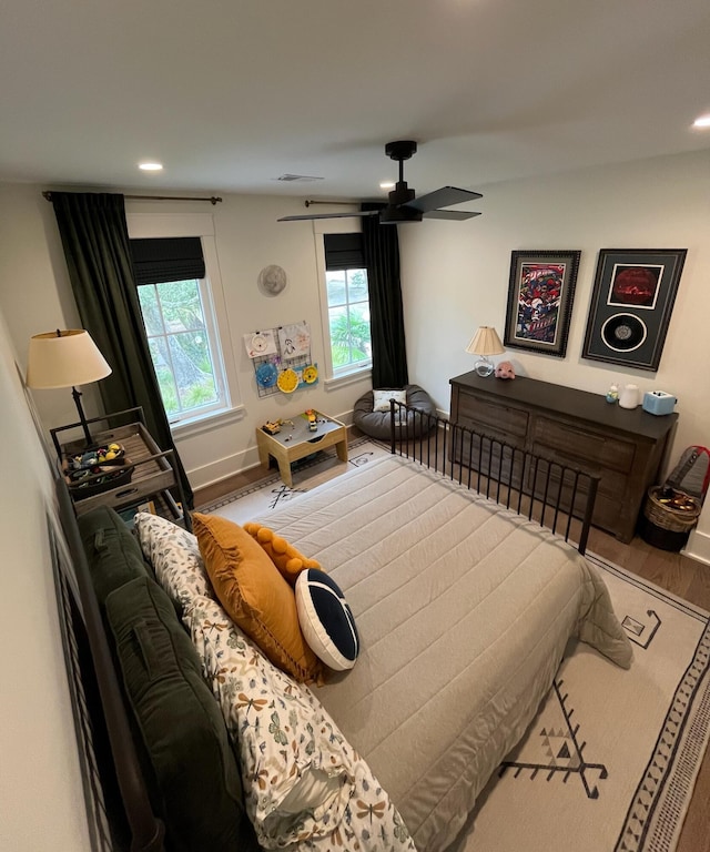 bedroom featuring recessed lighting, baseboards, and wood finished floors