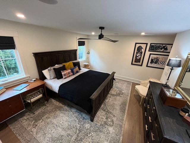 bedroom featuring a ceiling fan, recessed lighting, wood finished floors, and baseboards