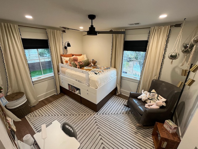 bedroom with recessed lighting, visible vents, baseboards, and dark wood-type flooring