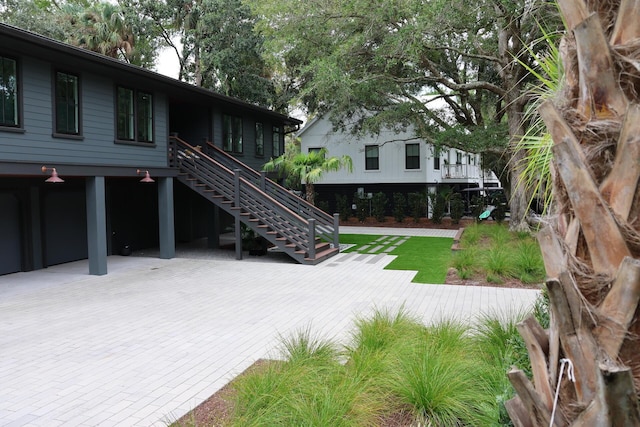 view of patio / terrace featuring stairway