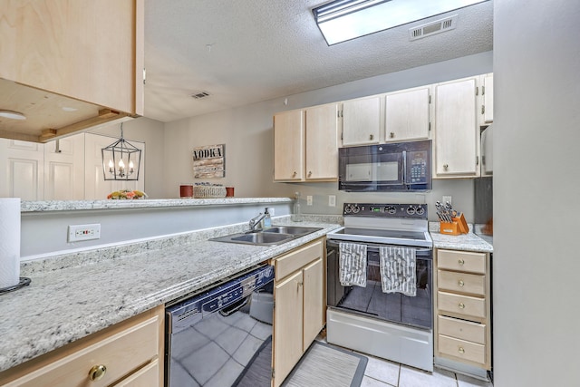 188 Midland Pkwy Unit 516, Summerville, SC 29485 - kitchen with black appliances, a sink, light tile patterned floors, light brown cabinetry, and a textured ceiling