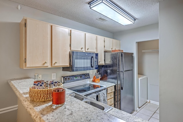 188 Midland Pkwy Unit 516, Summerville, SC 29485 - kitchen featuring black appliances, washer / clothes dryer, light brown cabinets, a textured ceiling, and light countertops