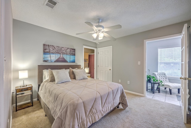 188 Midland Pkwy Unit 516, Summerville, SC 29485 - bedroom with light carpet, baseboards, a textured ceiling, and a ceiling fan