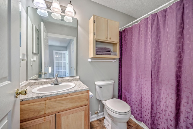 188 Midland Pkwy Unit 516, Summerville, SC 29485 - bathroom featuring toilet, vanity, a textured ceiling, and a shower with shower curtain