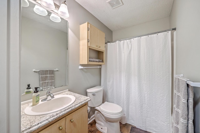 188 Midland Pkwy Unit 516, Summerville, SC 29485 - full bathroom with a textured ceiling, toilet, vanity, and curtained shower